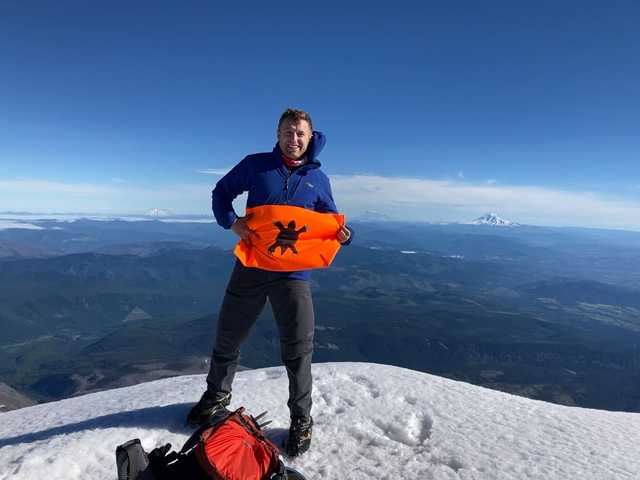 Snowy summit of Mount Hood with Mount Jefferson in the distance