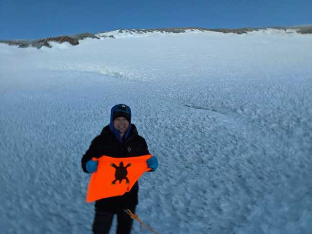 Icy summit crater of Mount Rainier, Justin in winter gear