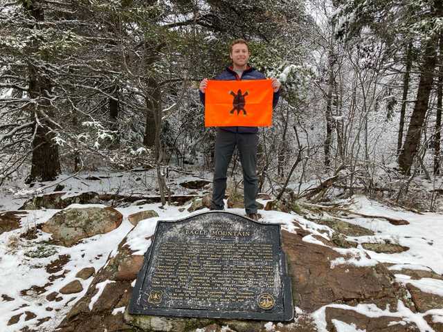 Eagle Mountain plaque in snowy woods