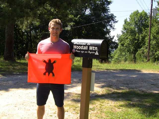Woodall Mountain register mailbox beside a gravel lot