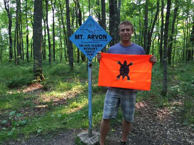 Blue Mount Arvon summit sign in a sunny forest