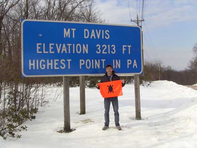 Deep snow beneath the blue Mount Davis elevation sign