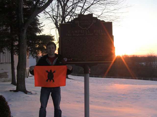 Campbell Hill historical marker at sunset over snow
