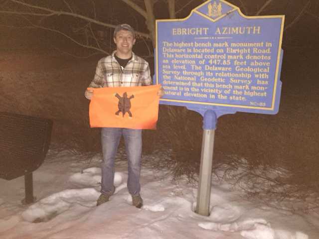 Ebright Azimuth historical marker at night in the snow