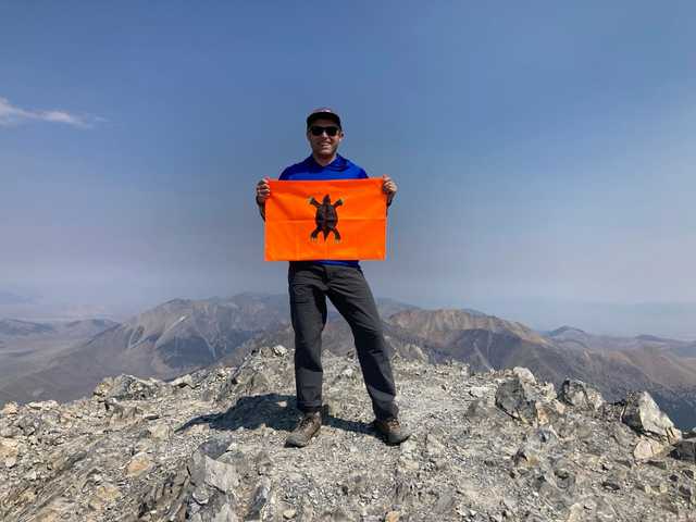 Rocky summit of Borah Peak under hazy skies